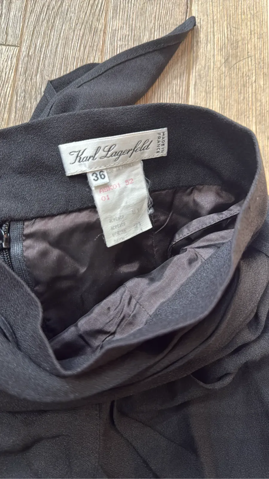 Short black Karl Lagerfeld skirt with a draped, knotted detail at the waist. 3