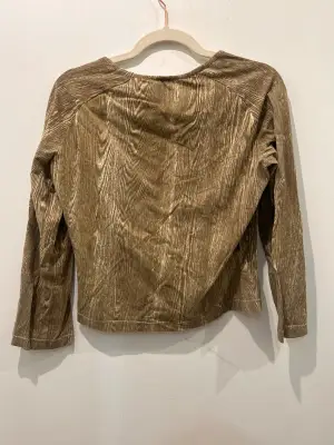 Top Roberto Cavalli vintage, taille 42, en très bon état. Une pièce unique pour un style affirmé et intemporel.