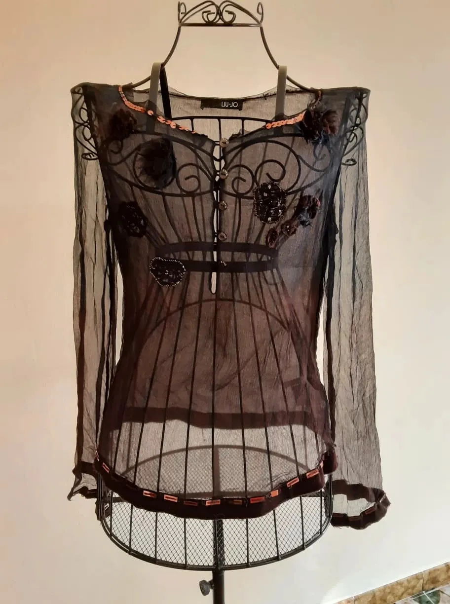Embroidered silk blouse adorned with beads