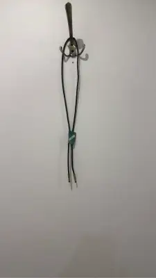Vintage bolo tie with black braided leather cord and turquoise agate stone pendant