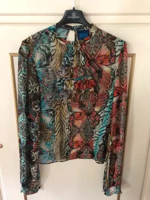 Blouse Kenzo en multicolore, pièce de la maison parisienne au style audacieux. Très bon état. Taille S (36).