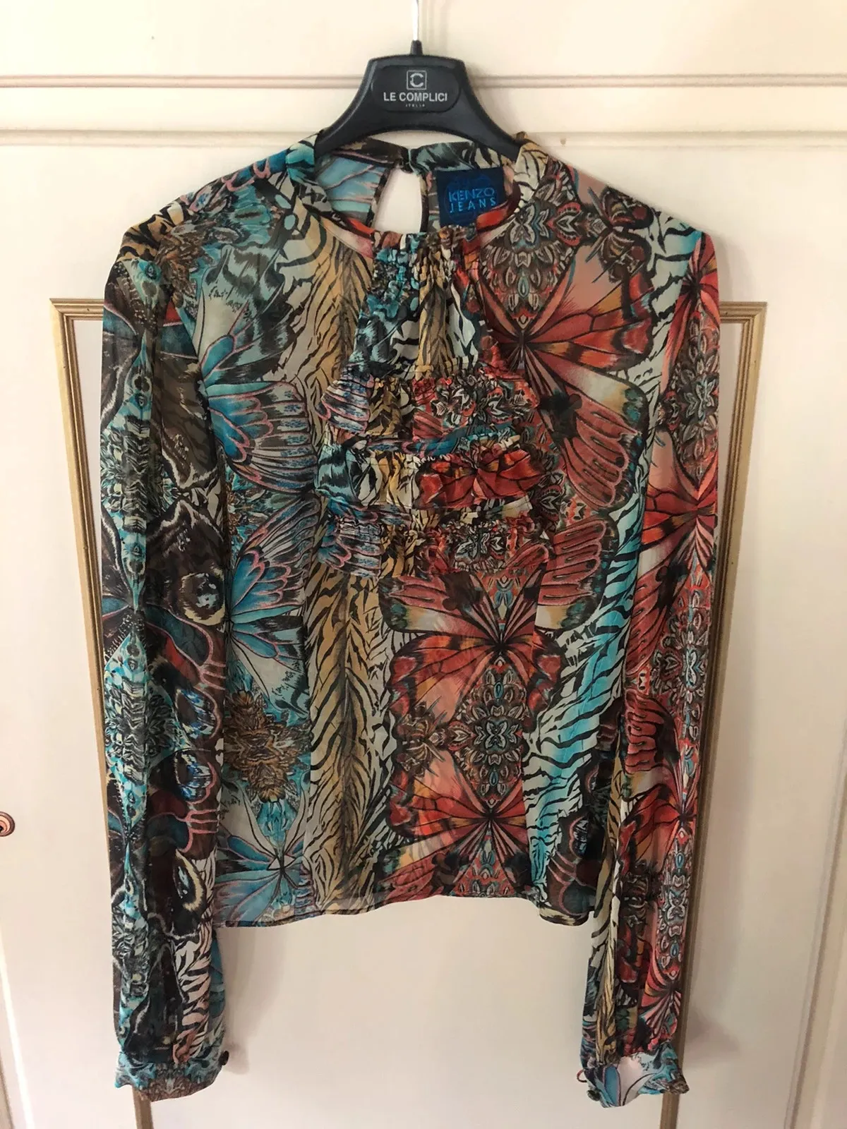 Kenzo blouse in multicolour, a piece from the bold Parisian house. Very good condition. Size S (36).