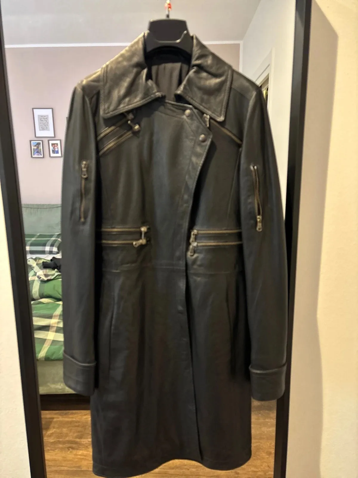 Faux-leather duster coat, closes at the front with snap buttons — very soft and warm thanks to its lightly padded lining