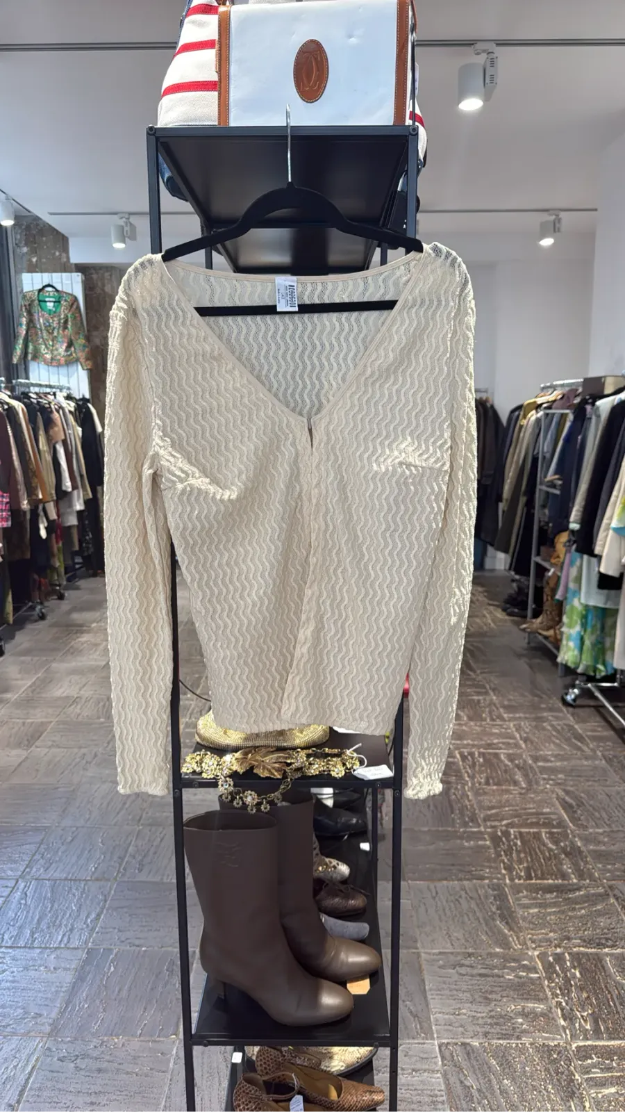 Ecru long-sleeve top in textured knit with V-neck and zip.