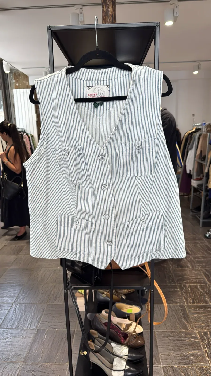 White and blue striped cotton sleeveless vest by Lauren Jeans Co. with logo buttons and flap pockets.