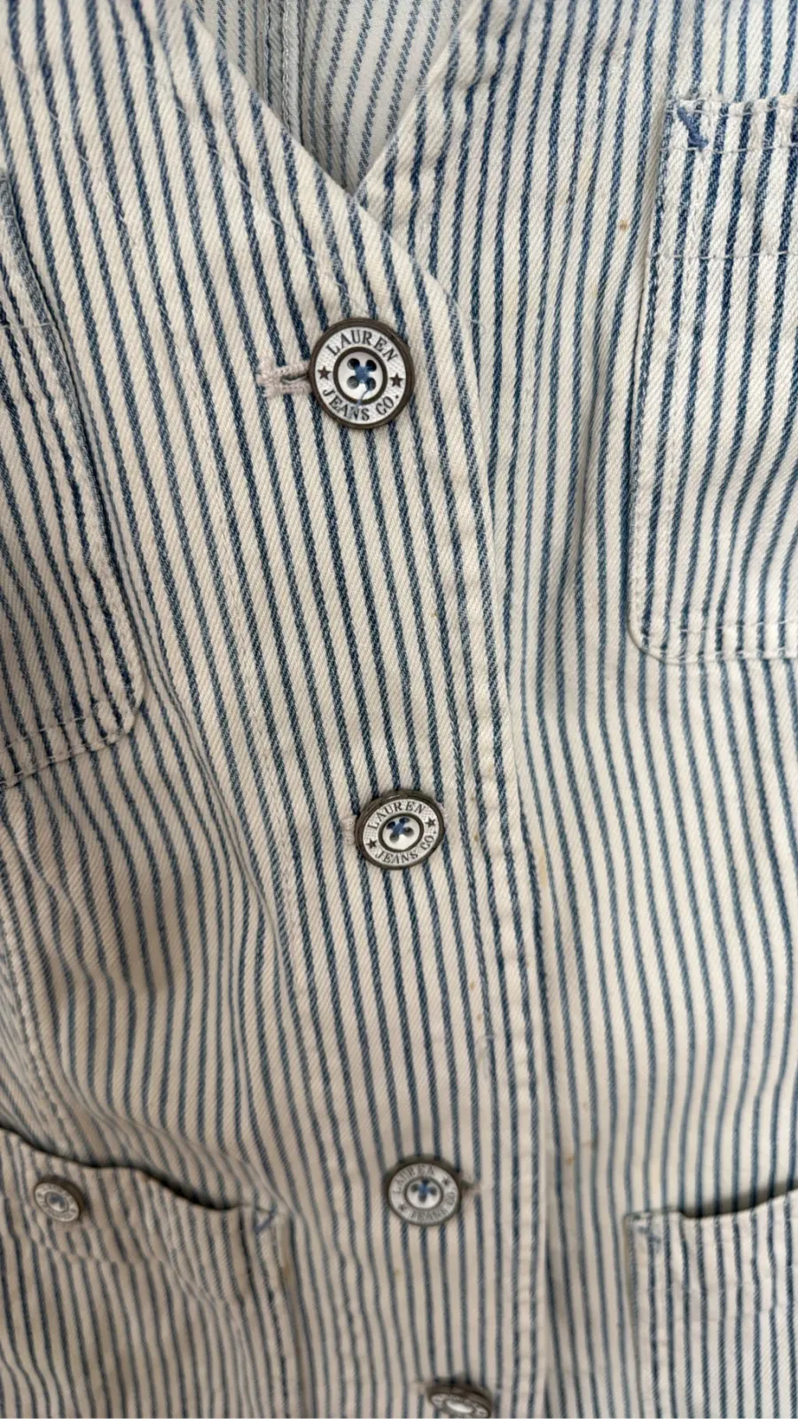 White and blue striped cotton sleeveless vest by Lauren Jeans Co. with logo buttons and flap pockets. 3