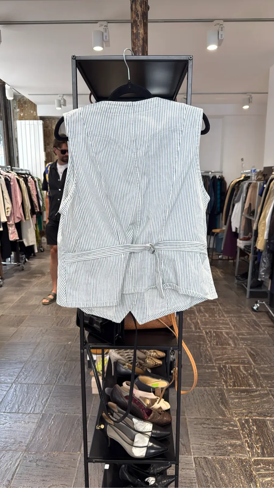 White and blue striped cotton sleeveless vest by Lauren Jeans Co. with logo buttons and flap pockets. 4