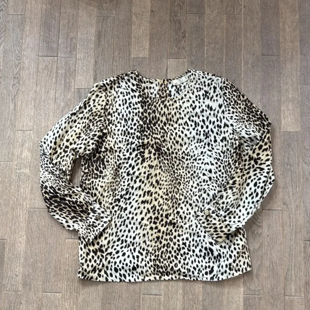 Vintage Valentino Miss V long-sleeved blouse with a classic leopard print.