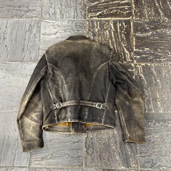 Double-breasted brown cowhide leather motorcycle jacket by GAS, with a distressed finish and zip details. 8