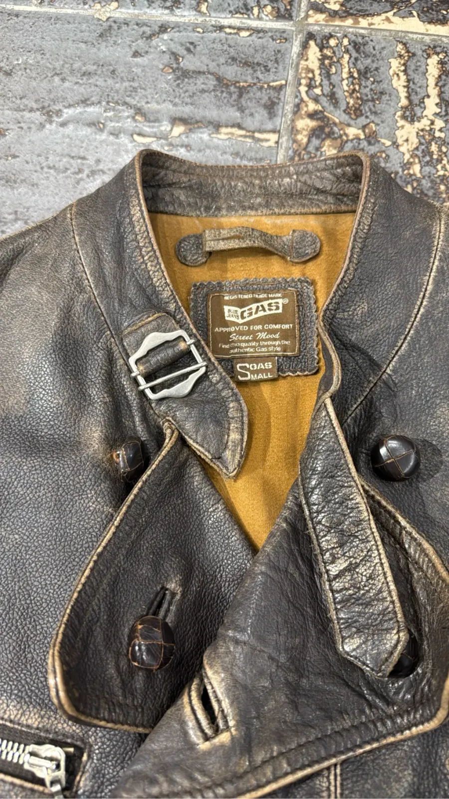 Double-breasted brown cowhide leather motorcycle jacket by GAS, with a distressed finish and zip details. 7