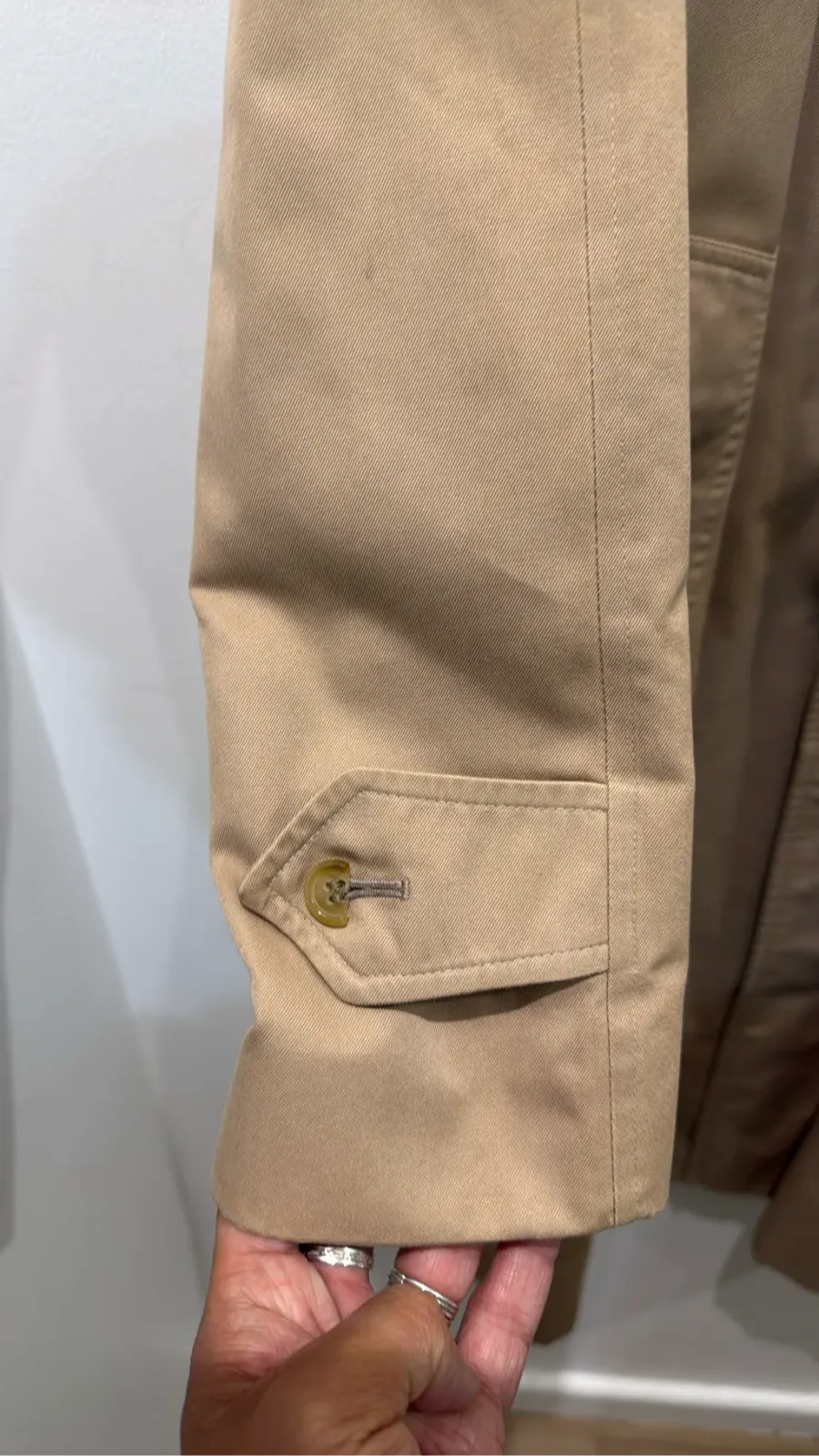 Classic Burberrys' trench coat in camel with check lining, showing a few visible stains on the front. 4
