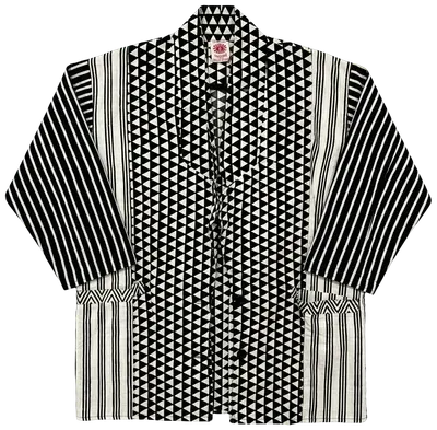 Black and white cotton kimono jacket with geometric patterns and stripes, designed in France and made in India.