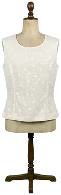 Top sans manches écru avec motif floral texturé et fermeture éclair au dos.