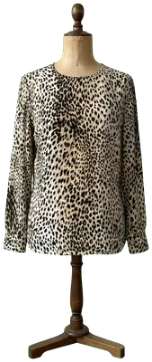 Blouse vintage Valentino Miss V à manches longues avec un imprimé léopard classique.