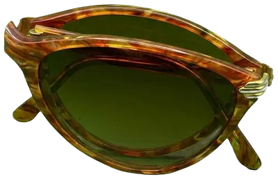 Lunettes de soleil vintage Yves Saint Laurent avec monture écaille de tortue marron et détails dorés, fabriquées en France.