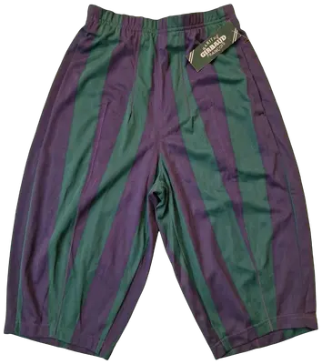 Marithè & Francois Girbaud Bermuda shorts, size 44. New with tags. Made in Italy in the late 80s from a fine and unique polyester fabric, typical of the brand. They feature a loose fit on the thigh that tapers towards the bottom. Stylistic creativity and design skill merge in this iconic piece that transcends time. As shown in the photos, the Bermuda shorts are NEW with a plastic seal on the tag, making them a true rarity. Intended for collectors, brand enthusiasts, and anyone desiring a piece with vintage charm and contemporary appeal.
Run very small.
Elasticated waistband.
Welt back pockets.
100% polyester fabric.
Made in Italy.